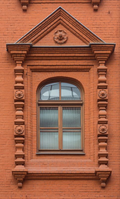 Arched windows with decorative trim